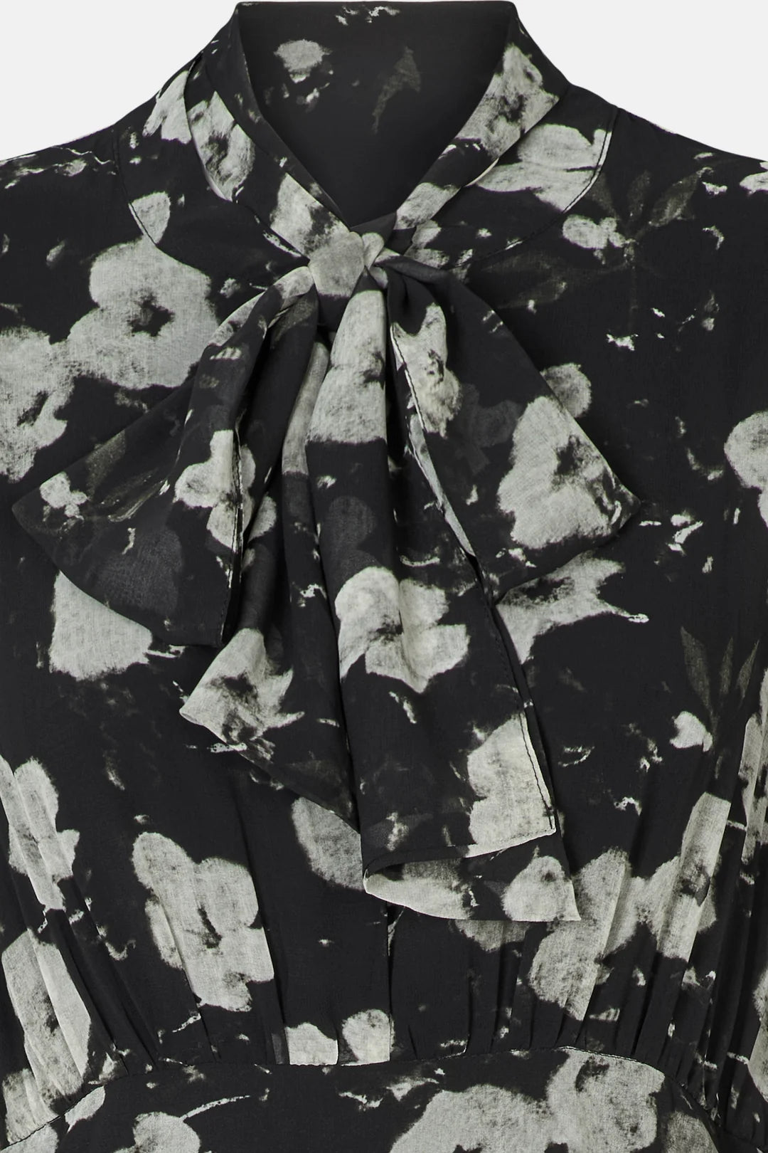 Close-up of Rue de Femme Paxton high tie bow neckline and floral print