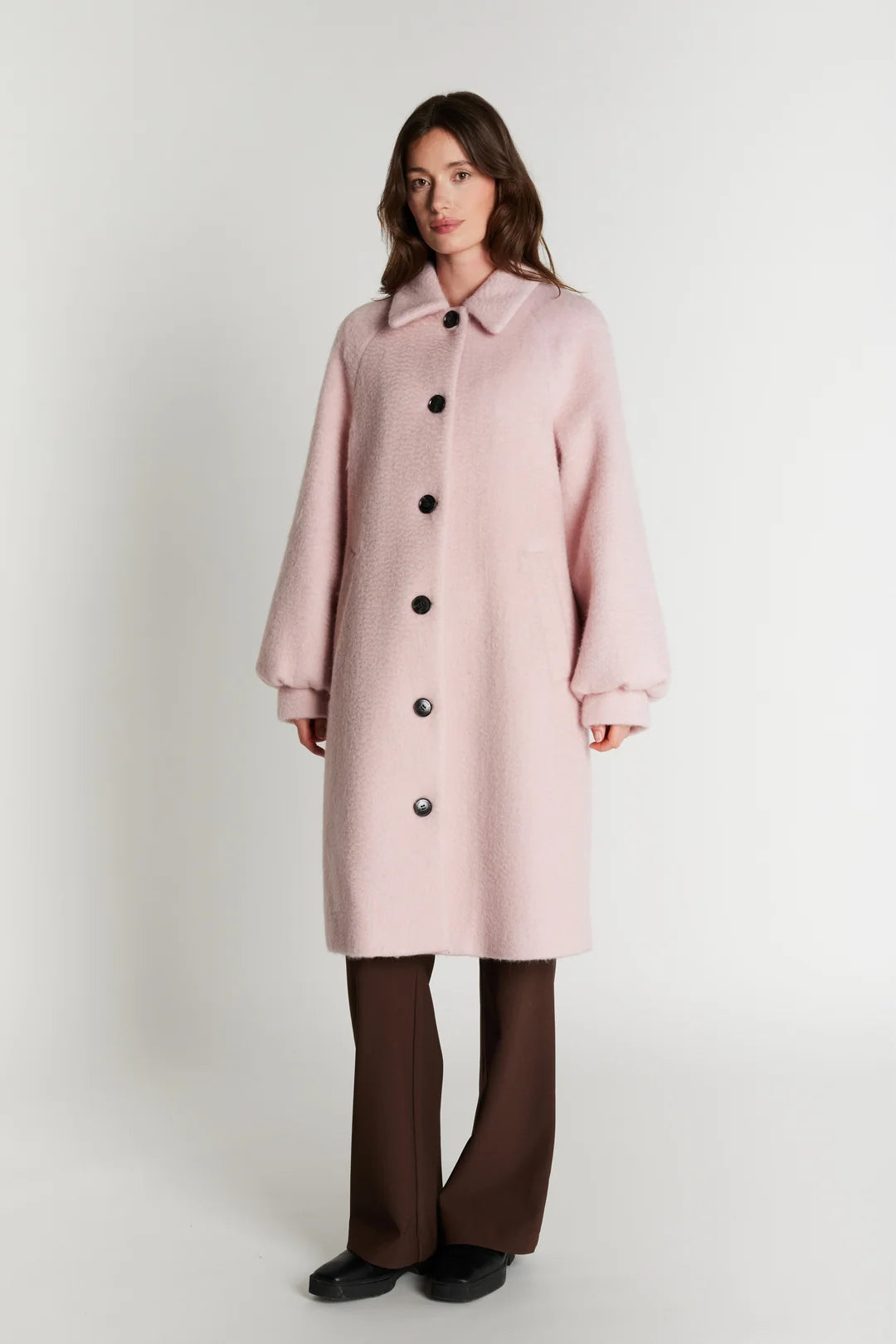Rue de Femme Addison blush pink knee length coat styled with brown trousers