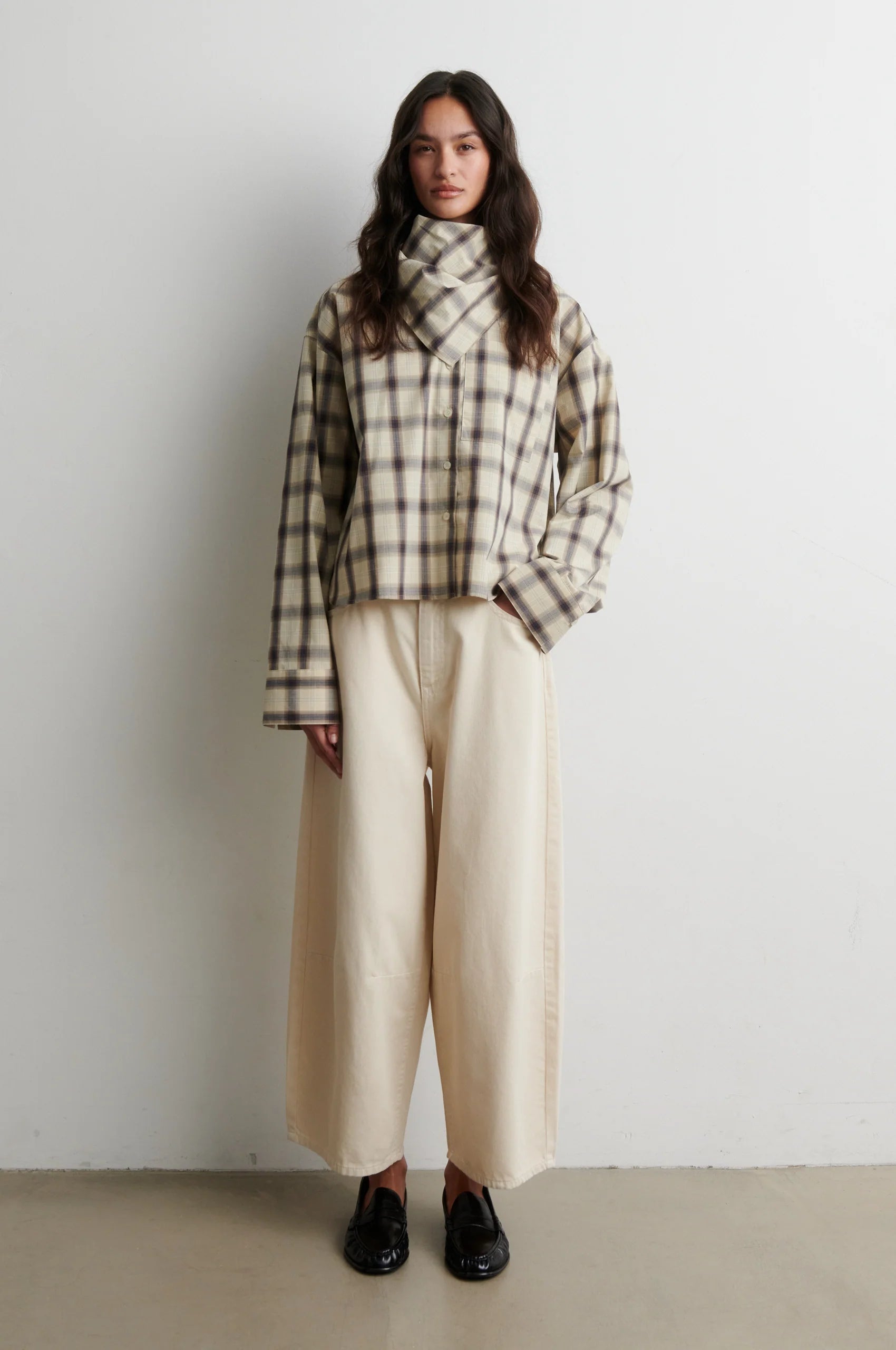 Full-length view of Second Female Liria cream check shirt with cream trousers