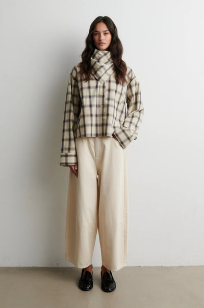 Full-length view of Second Female Liria cream check shirt with cream trousers